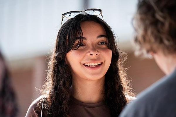 Returning student happy to be seeing friends again